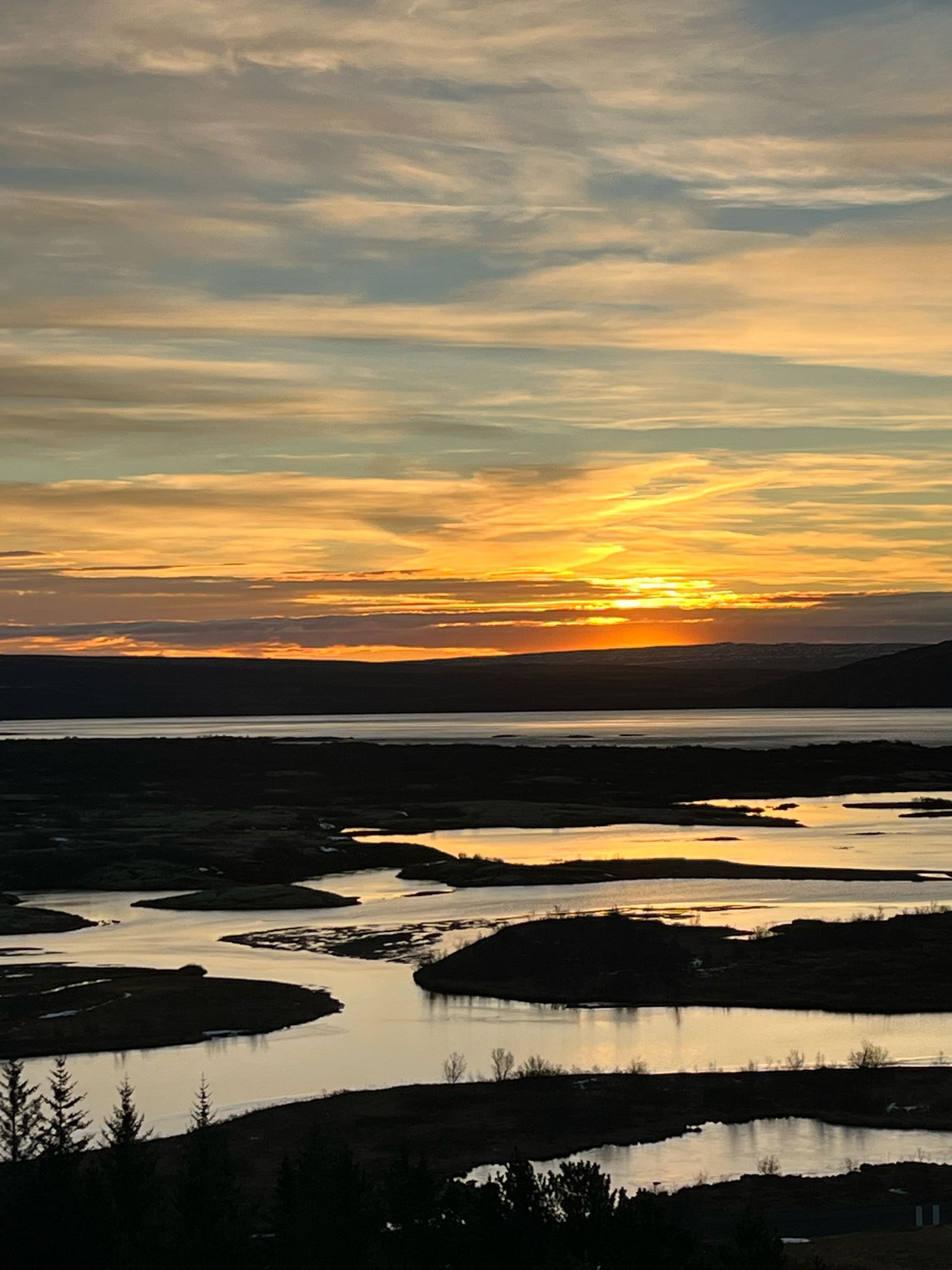 Sunset over a river valley, a moment of quiet reflection